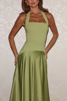 Woman wearing Runaway The Label Odina Square Neck Maxi Dress in Palm

