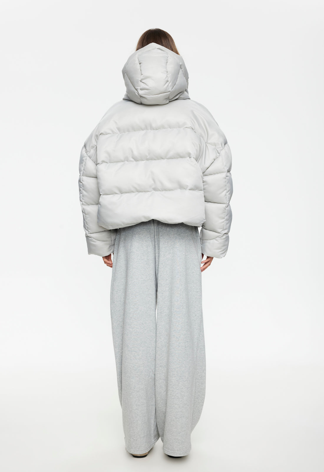 Woman wearing Lioness Cindy Puffer Jacket in Ash