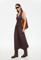 Woman wearing Lioness Stars Align Midi Dress in Brown