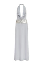 Woman wearing Runaway The Label Marcella Deep Plunge Maxi Dress in Silver