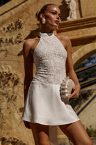 Senna Halter Open Back Mini Dress in White by Runaway The Label | Winsome Girl Fashion 